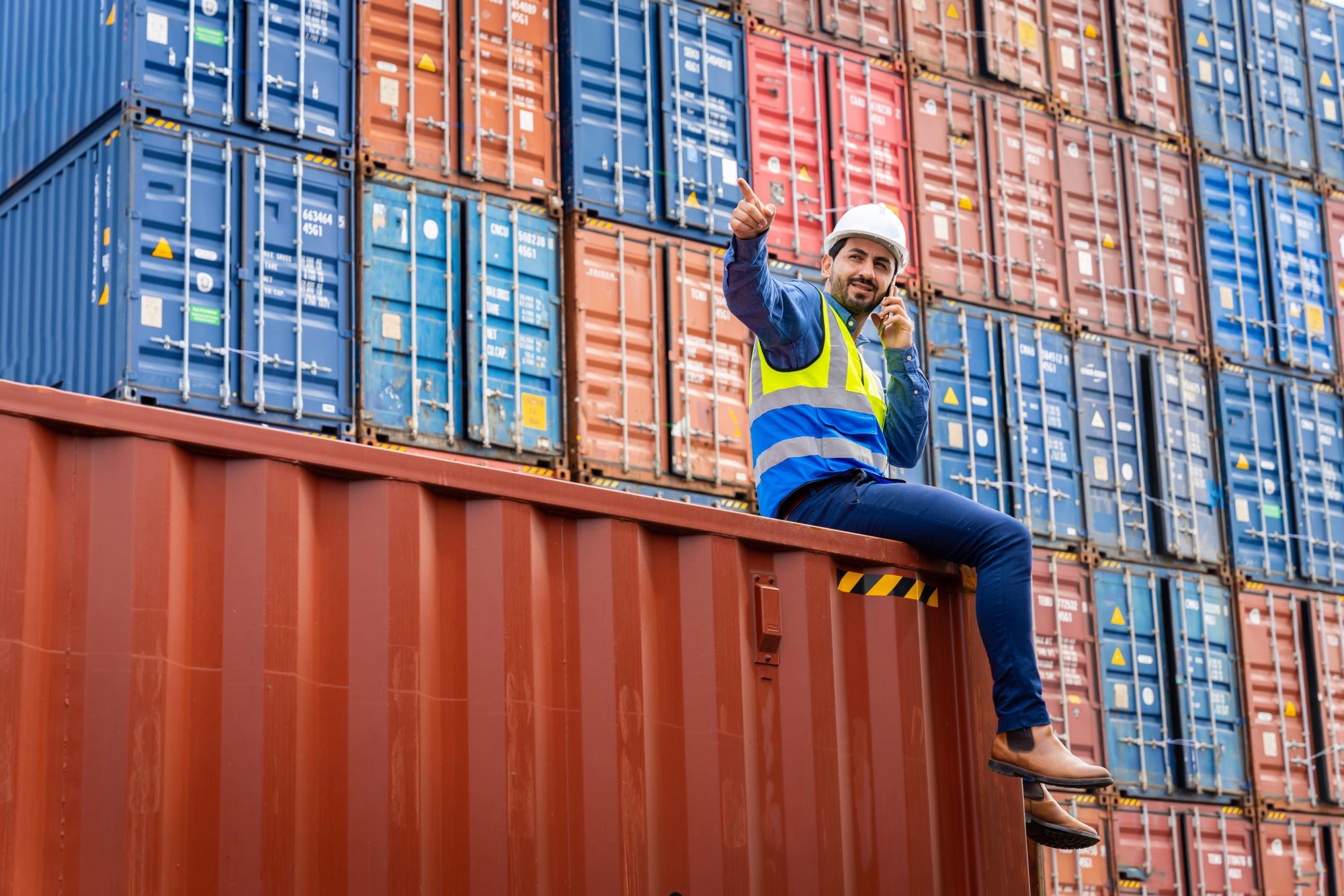 male engineers in a container shipping company Consulting