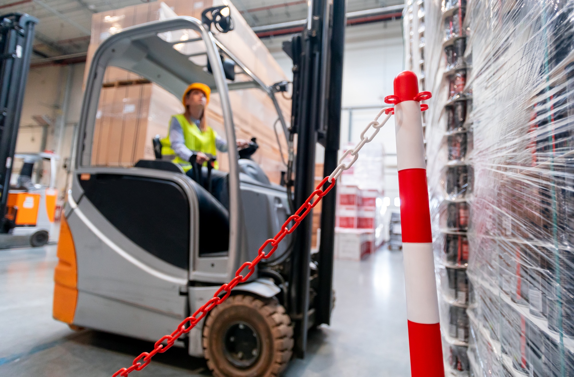 Safety at work with forklift in warehouse