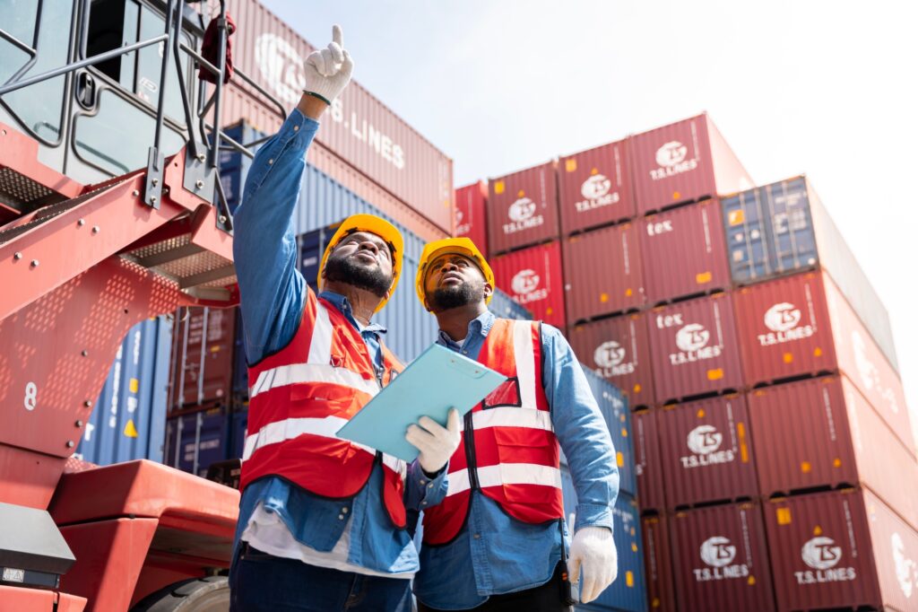 Two male engineers in a container shipping company Consulting